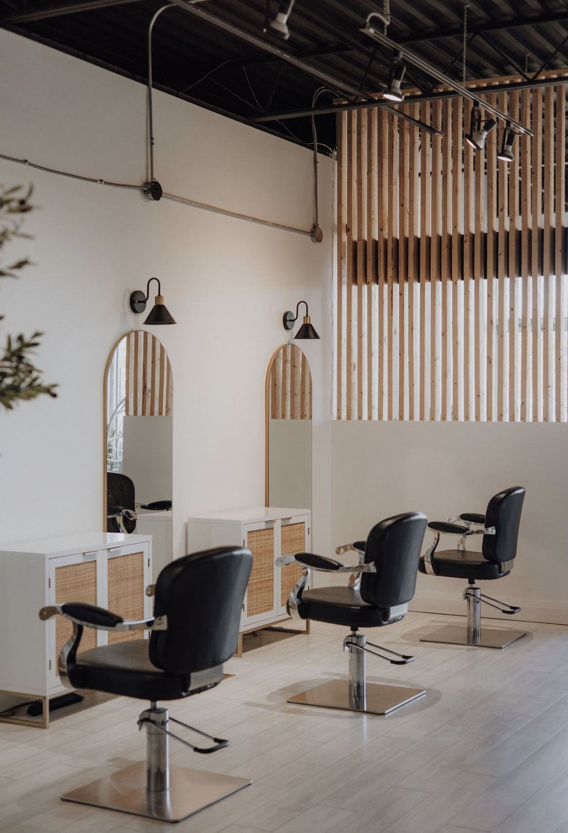 Styling stations and warm wood detail inside the Marigold + Aster studio