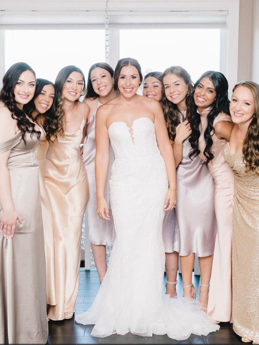 Bride with her bridesmaids in champagne and blush satin