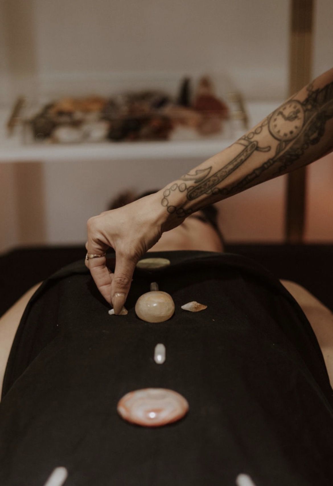 Stones being placed during a healing session