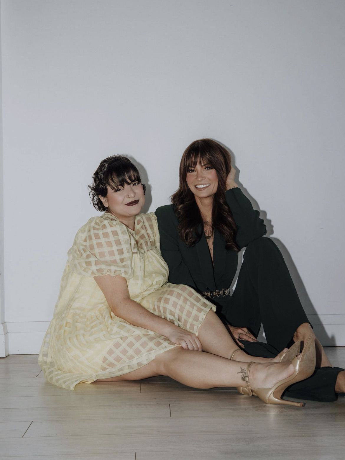 Christina and Koleen seated together in the studio